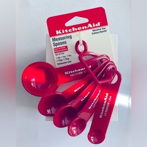 Brand new set Kitchen Aid measuring spoons